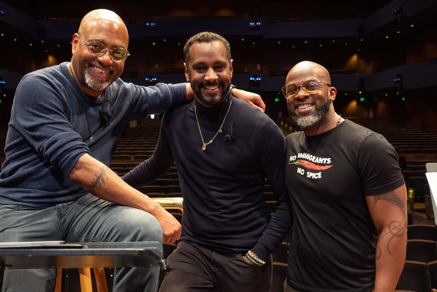 Conductor William Eddins, Carlos Simon and Marc Bamuthi Joseph pose smiling at the first reading session for brea(d)th